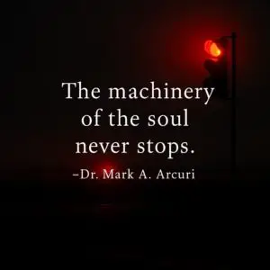 A glowing red traffic light illuminates a dark road at dawn, with the quote “The machinery of the soul never stops.” — Dr. Mark A. Arcuri displayed in white text.