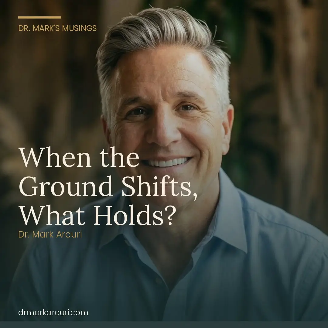 Portrait of Dr. Mark Arcuri with the blog post title "When the Ground Shifts, What Holds?" overlaid in large serif type — a reflection on inner orientation, Dr. Mark's Musings at drmarkarcuri.com